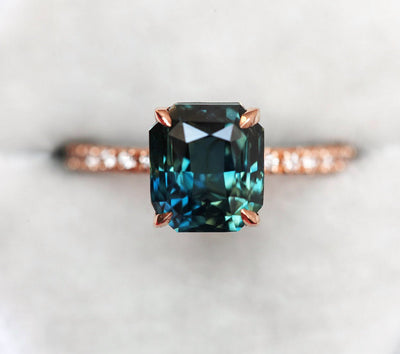 Radiant teal sapphire ring with nested diamonds and tourmaline