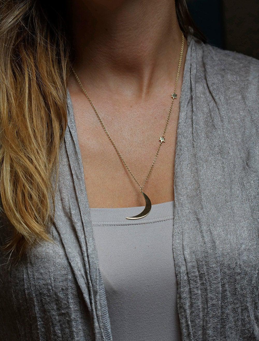 Gold necklace with crescent moon and stars