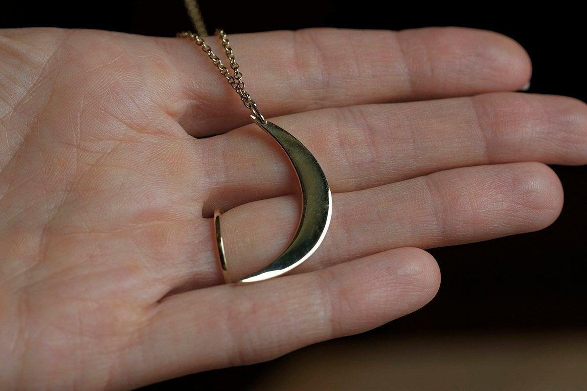 Gold necklace with crescent moon and stars