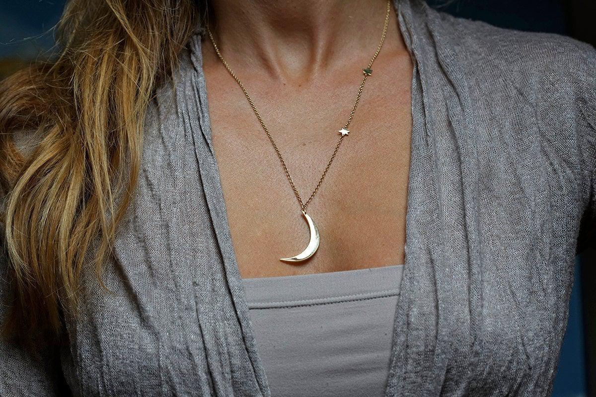 Gold necklace with crescent moon and stars