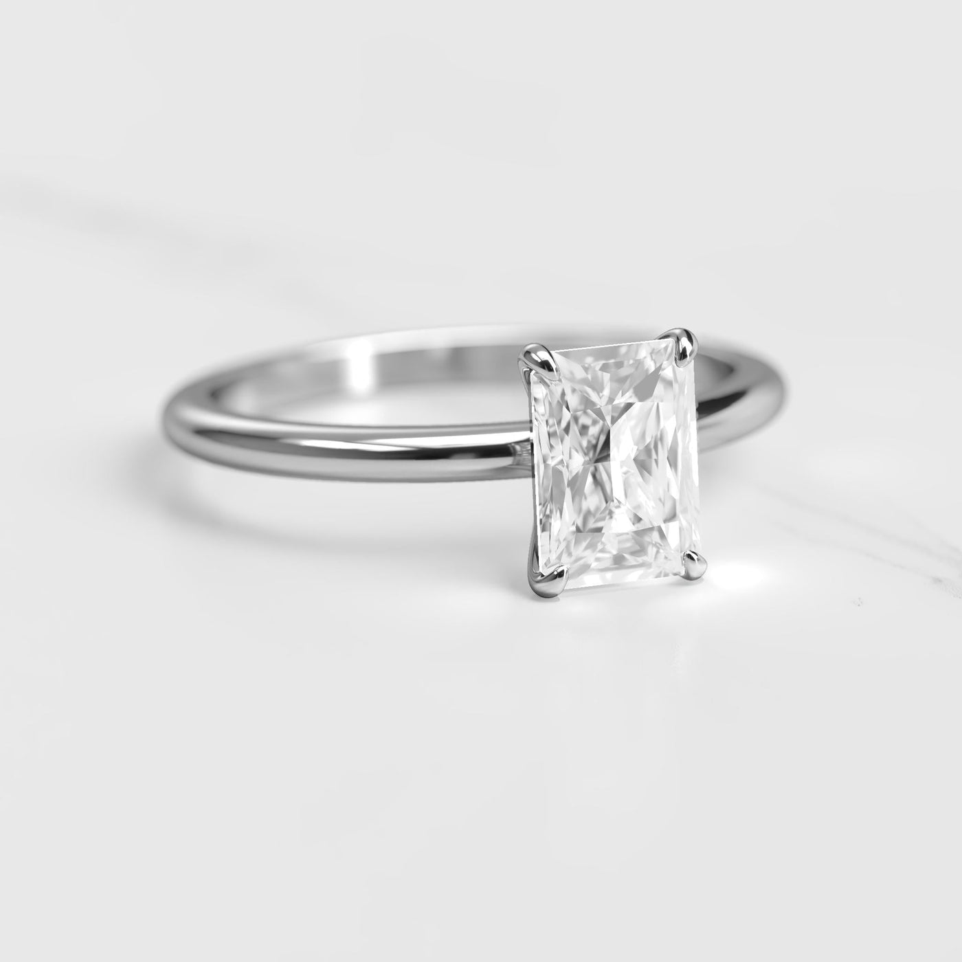 Radiant tapered solitaire moissanite ring