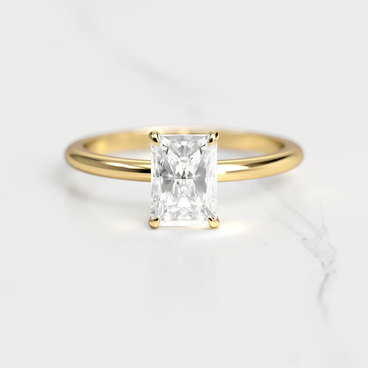 Radiant tapered solitaire moissanite ring