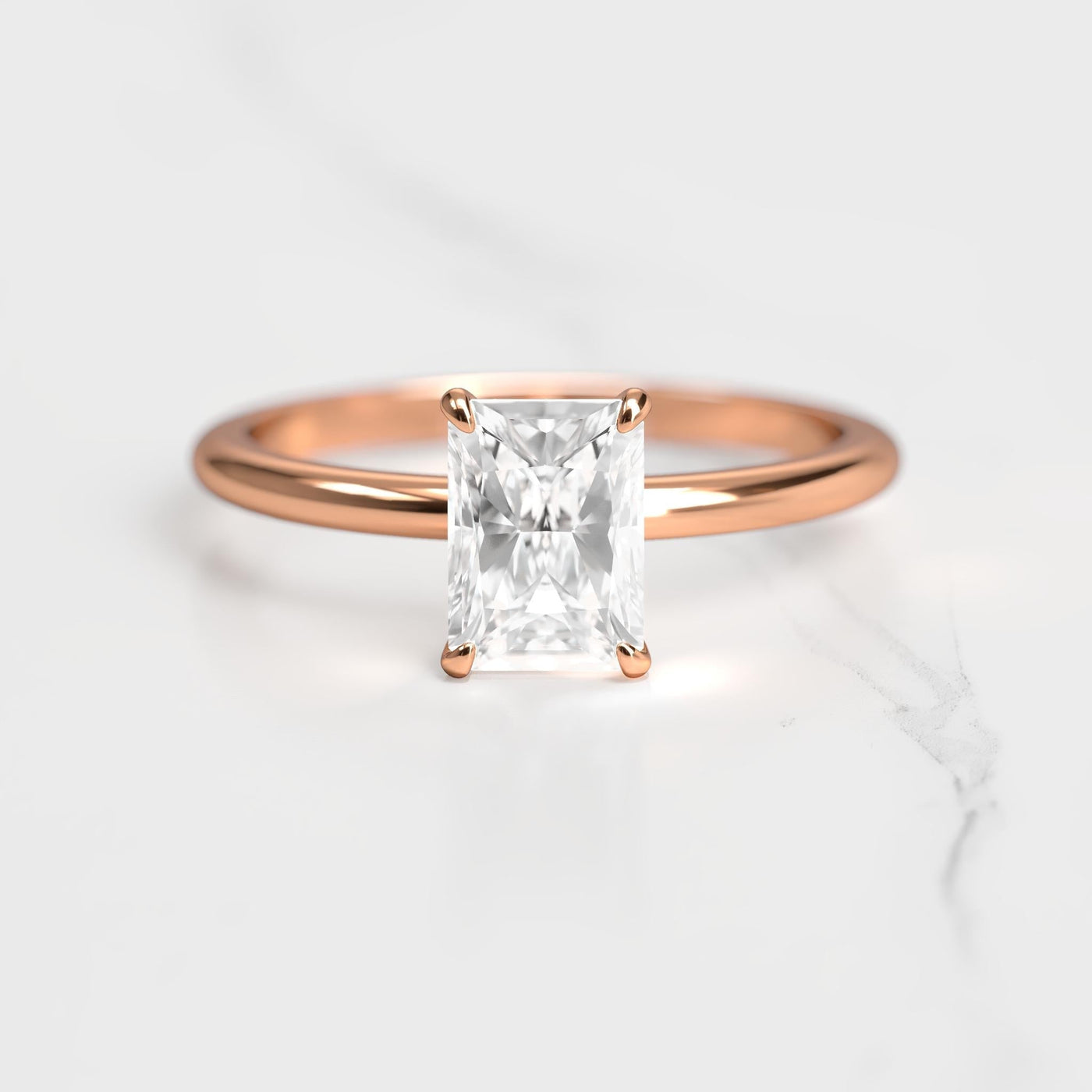 Radiant tapered solitaire moissanite ring