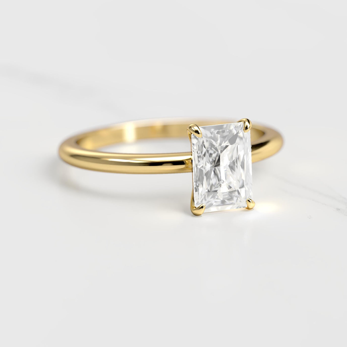 Radiant tapered solitaire moissanite ring