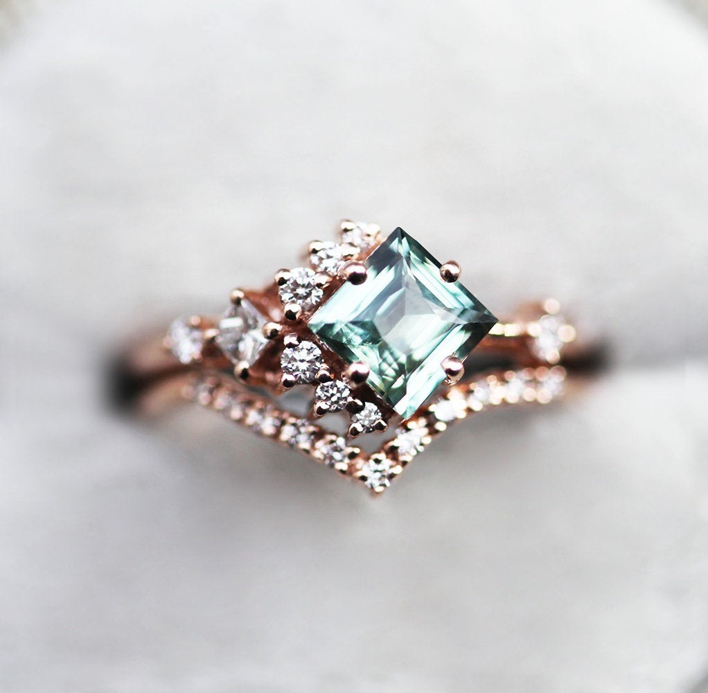 Mint-colored square sapphire with side diamonds