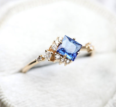 Princess-shaped sapphire ring with diamond cluster