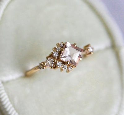 Square-shaped white sapphire ring with diamond cluster