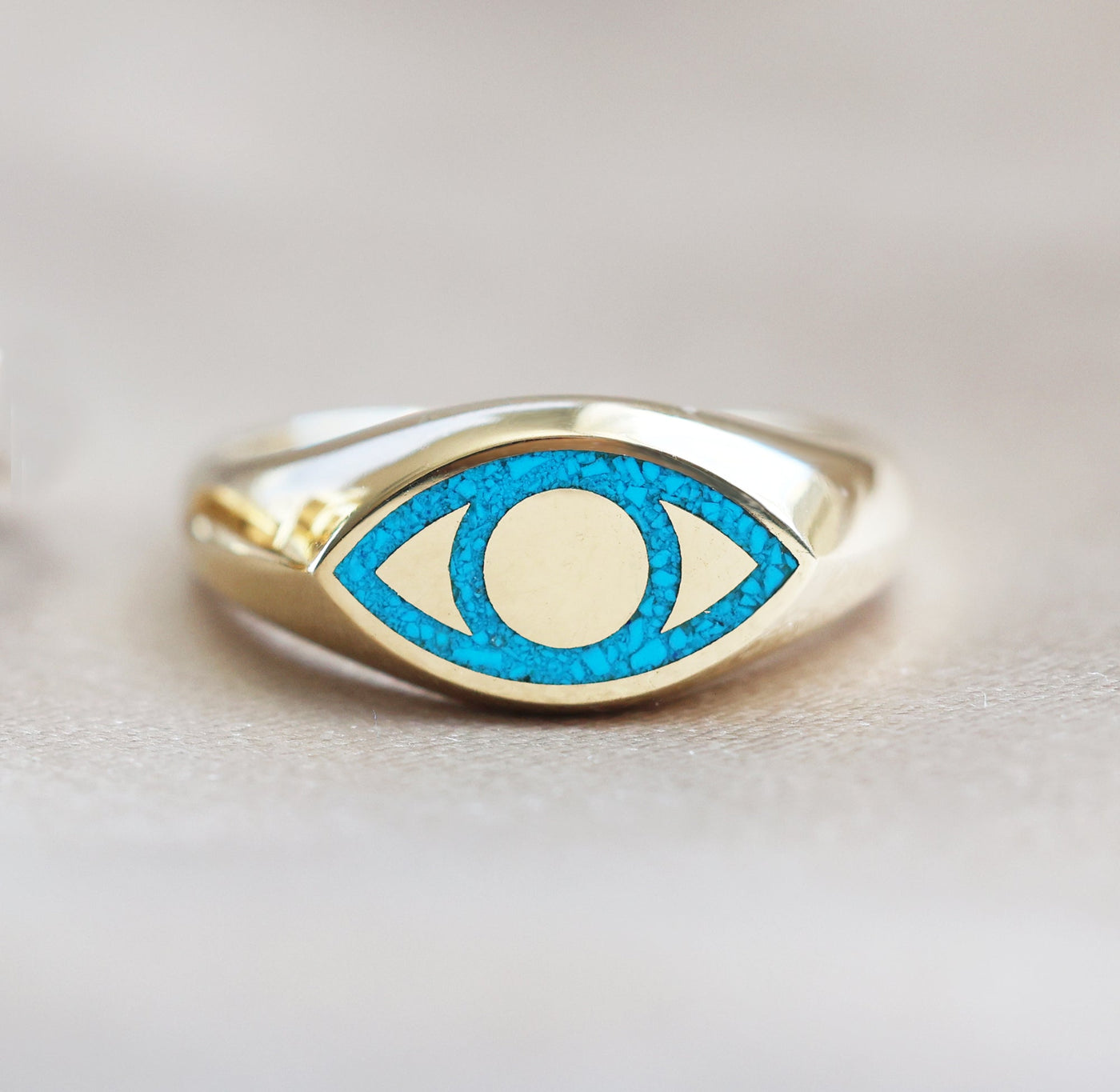 Gold or platinum signet ring with black spinel inlay, featuring an all-seeing eye design.