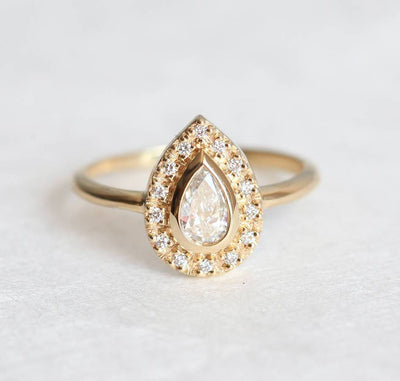 Pear White Diamond Halo Engagement Ring with Full Diamond Halo Around the Centerpiece