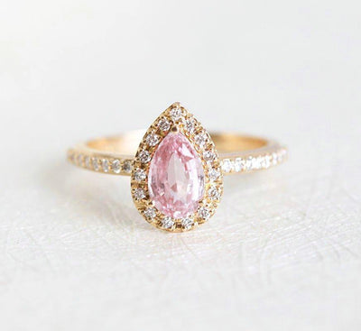 Pear-shaped pink ceylon sapphire ring with diamond halo