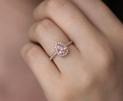 Pear-shaped pink ceylon sapphire ring with diamond halo