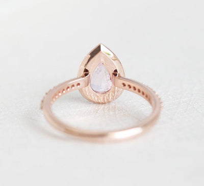 Pear-shaped pink ceylon sapphire ring with diamond halo