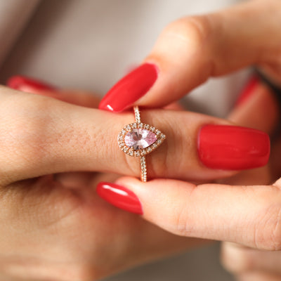 Pear-shaped pink ceylon sapphire ring with diamond halo