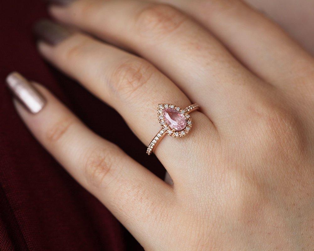 Pear-shaped pink ceylon sapphire ring with diamond halo