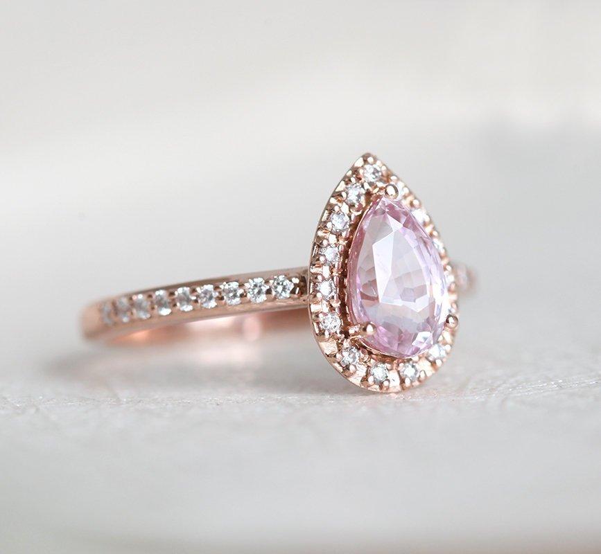 Pear-shaped pink ceylon sapphire ring with diamond halo