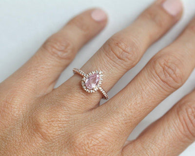 Pear-shaped pink ceylon sapphire ring with diamond halo