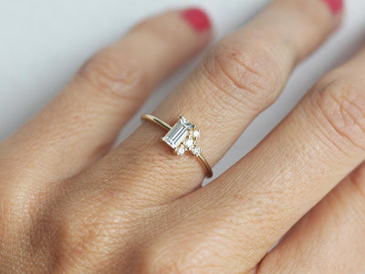 Baguette-shapped white sapphire cluster ring with side diamonds