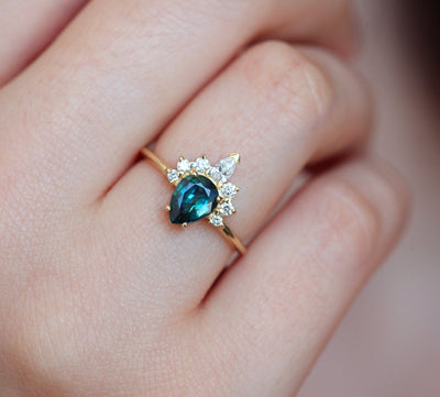 Pear-shaped teal sapphire ring diamond halo