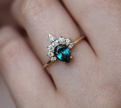 Pear-shaped teal sapphire ring diamond halo