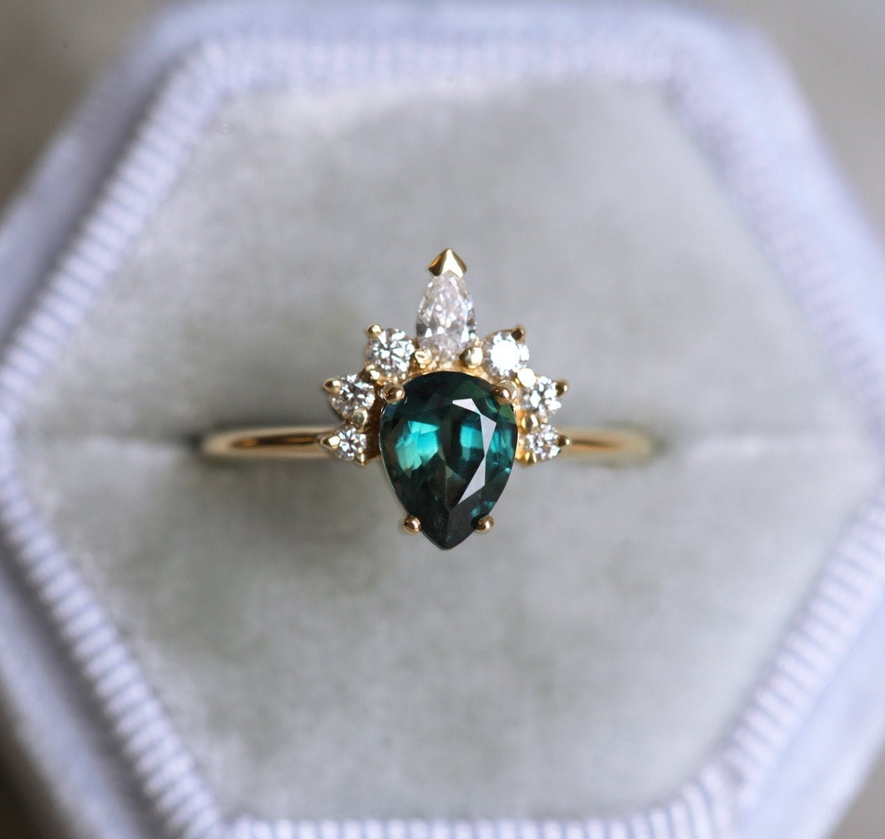 Pear-shaped teal sapphire ring diamond halo