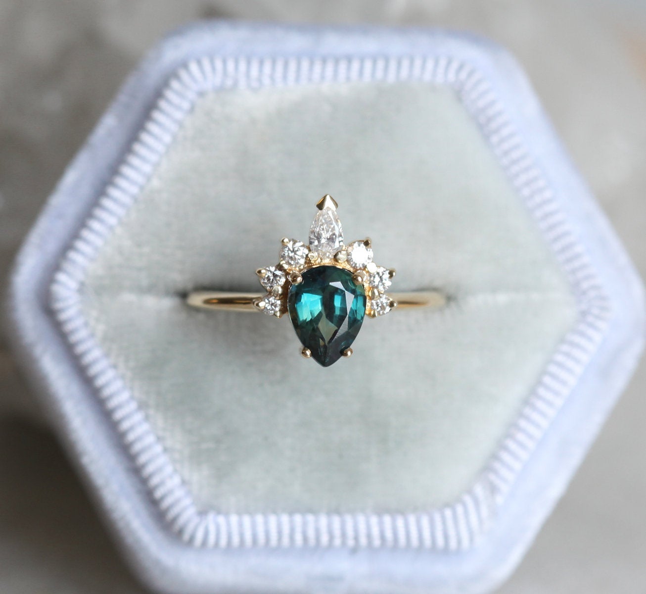 Pear-shaped teal sapphire ring diamond halo