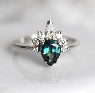 Pear-shaped teal sapphire ring diamond halo