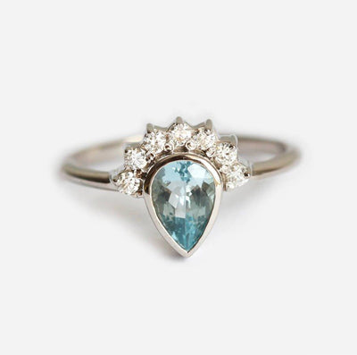 Pear Aquamarine Ring with Round White Diamonds forming a Halo