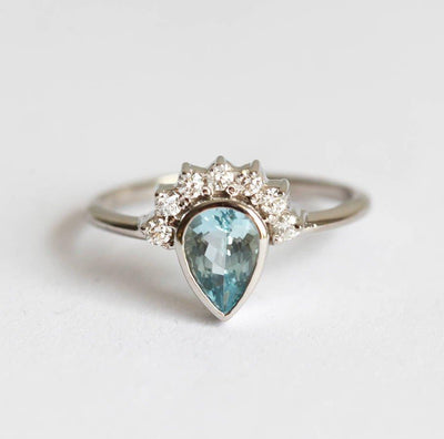 Pear Aquamarine Ring with Round White Diamonds forming a Halo