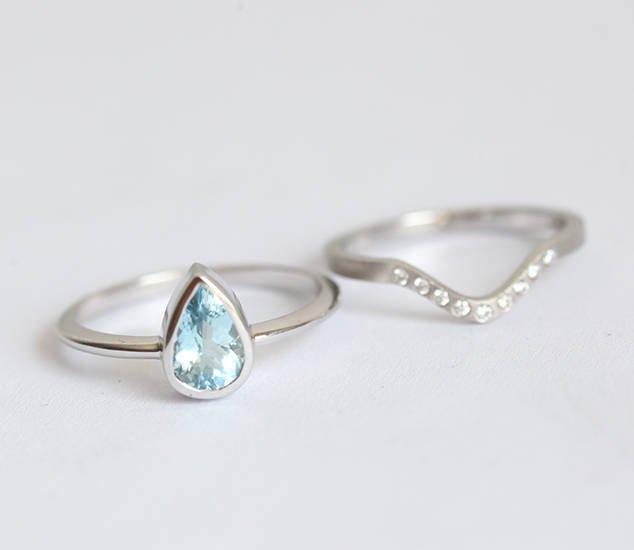Pear-shaped solitaire-style aquamarine ring and wedding band