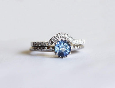 Blue round sapphire ring with eternity diamonds