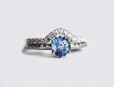 Blue round sapphire ring with eternity diamonds