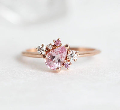 Pear-shaped pink sapphire ring with diamond cluster