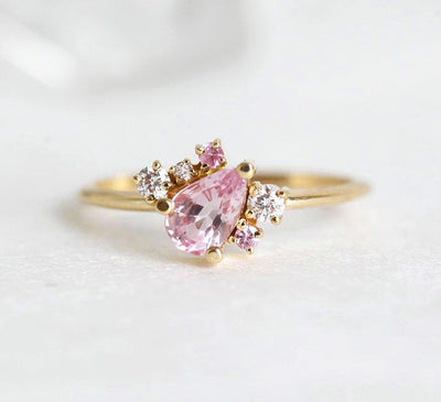 Pear-shaped pink sapphire ring with diamond cluster