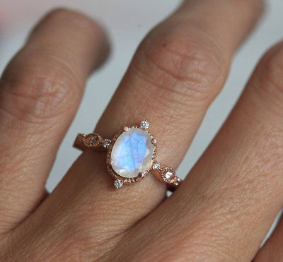 Oval Moonstone Vintage Eye-Shape Rose Gold Engagement Ring with Side Round White Diamonds