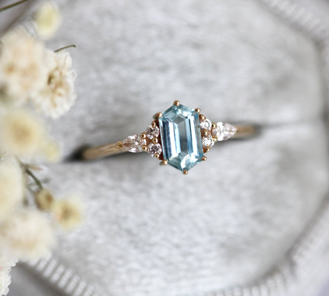 Engagement ring with aquamarine side stones