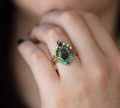 Oval Moss Agate Ring with Round Black Diamonds on the Band and Side Emeralds and White Diamonds