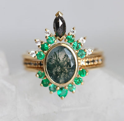 Oval Moss Agate Ring with Round Black Diamonds on the Band and Side Emeralds and White Diamonds