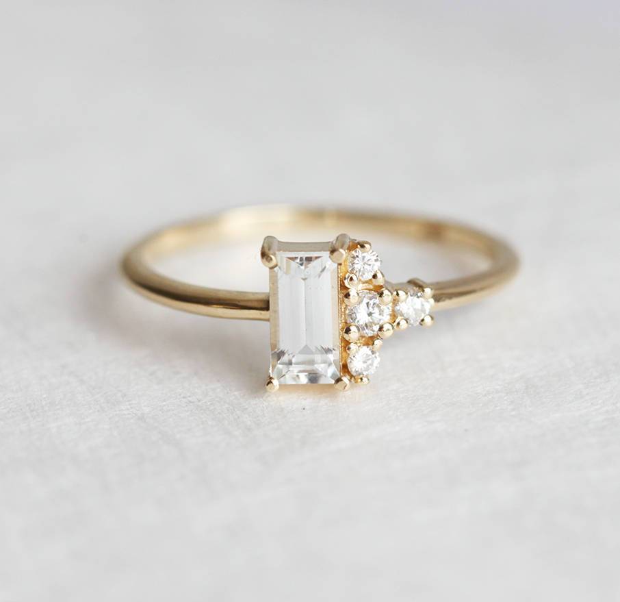 Baguette-shaped white sapphire ring with diamond cluster