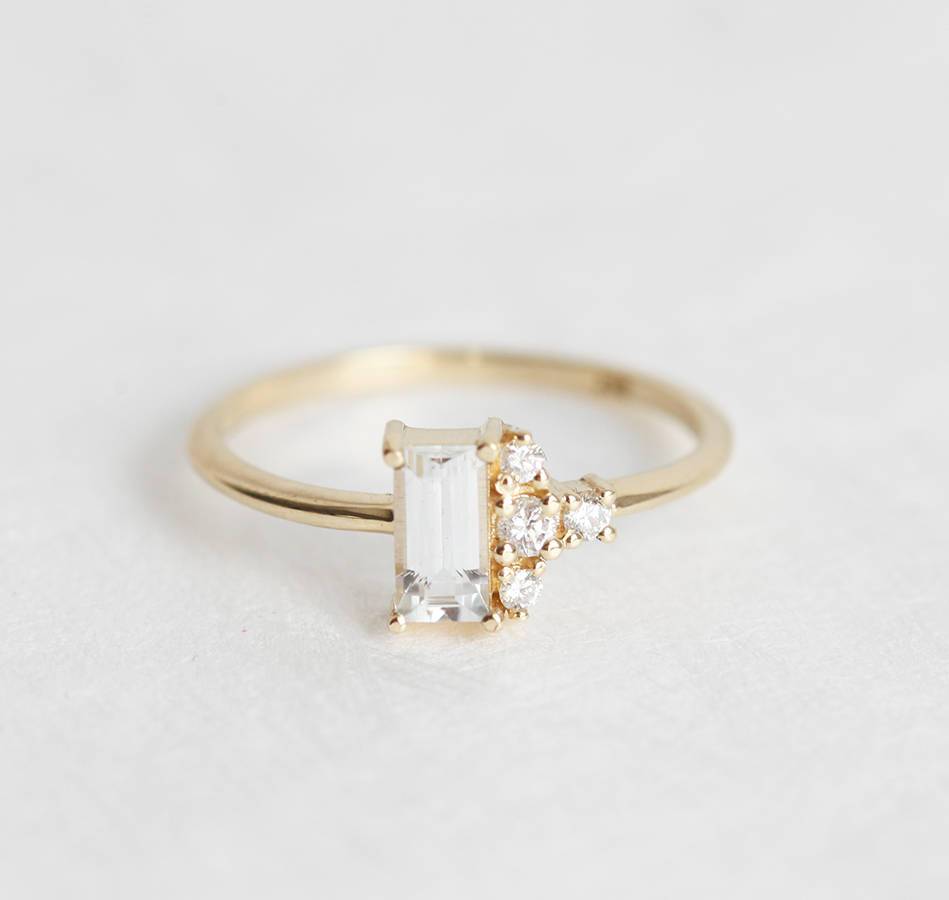 Baguette-shaped white sapphire ring with diamond cluster