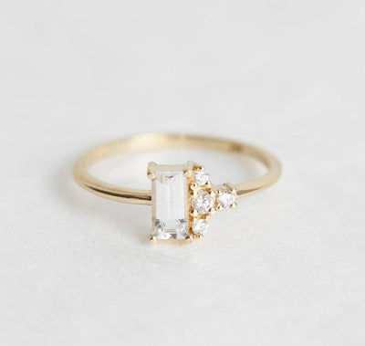 Baguette-shaped white sapphire ring with diamond cluster