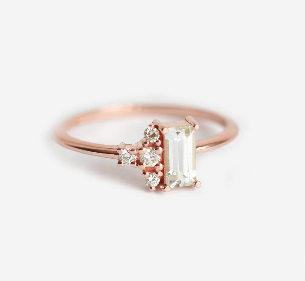 Baguette-shaped white sapphire ring with diamond cluster