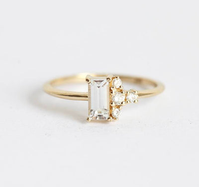 Baguette-shaped white sapphire ring with diamond cluster