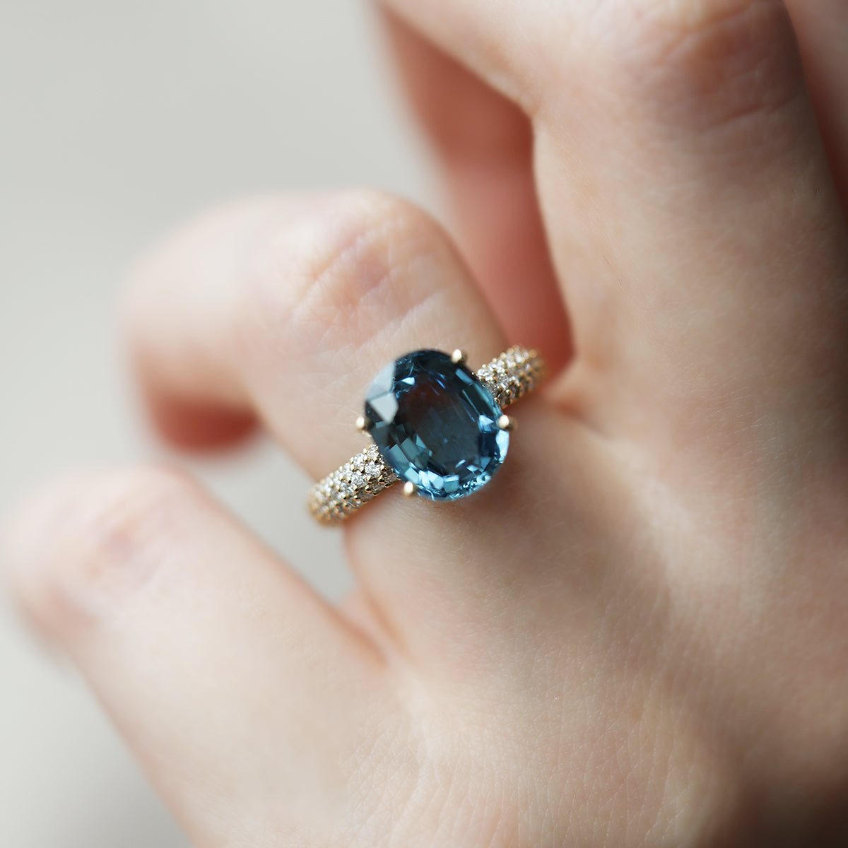 Blue oval-shaped cushion sapphire ring