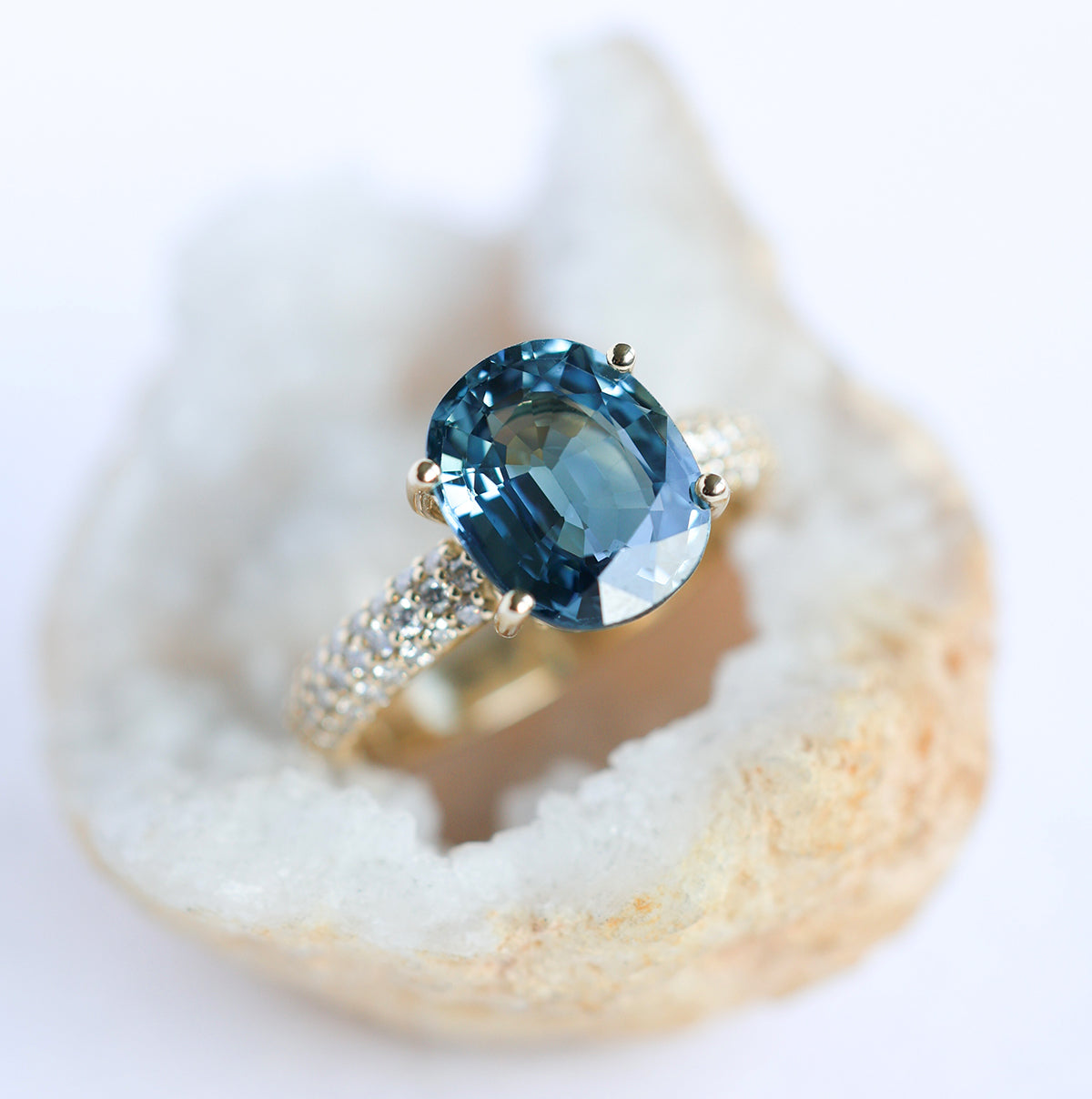 Blue oval-shaped cushion sapphire ring