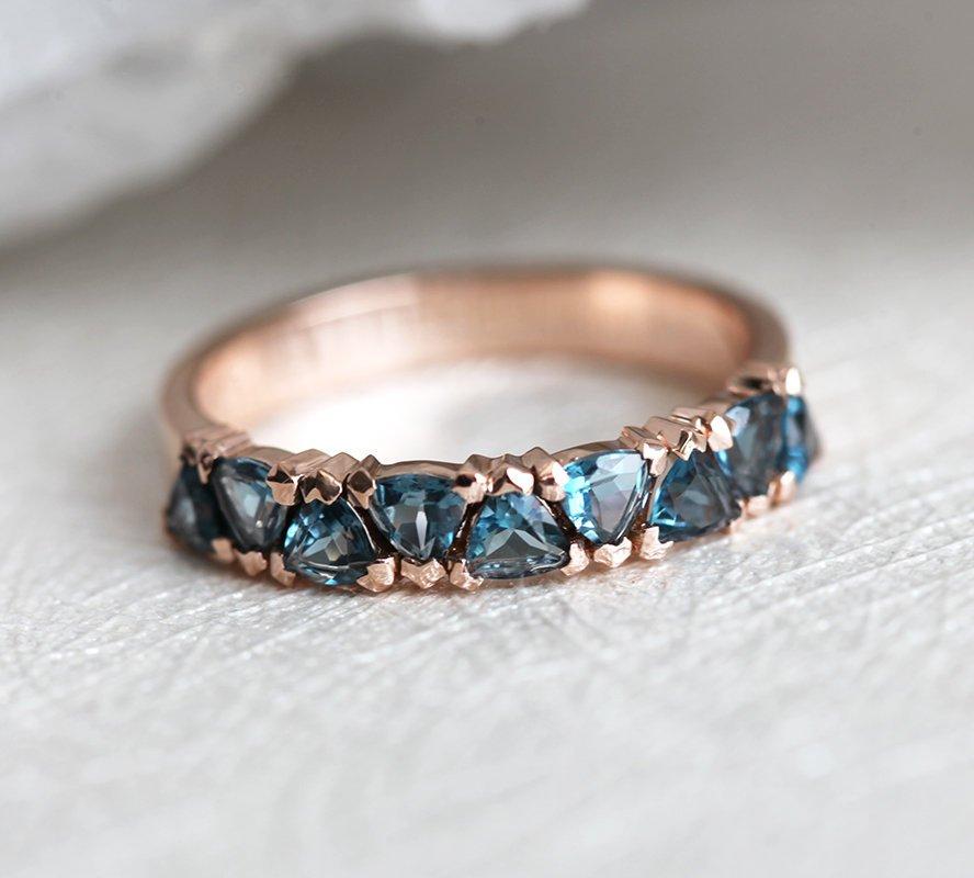 Trillion-cut sky blue topaz eternity wedding band