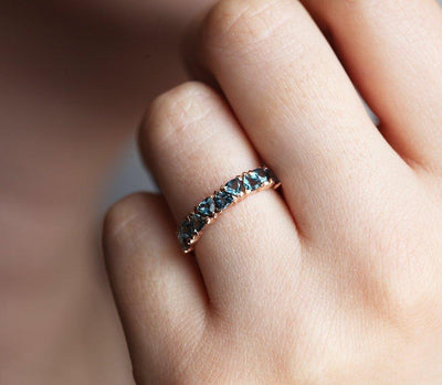 Trillion-cut sky blue topaz eternity wedding band