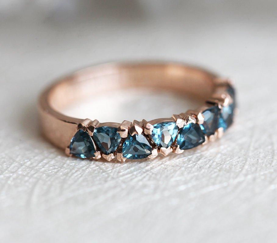 Trillion-cut sky blue topaz eternity wedding band