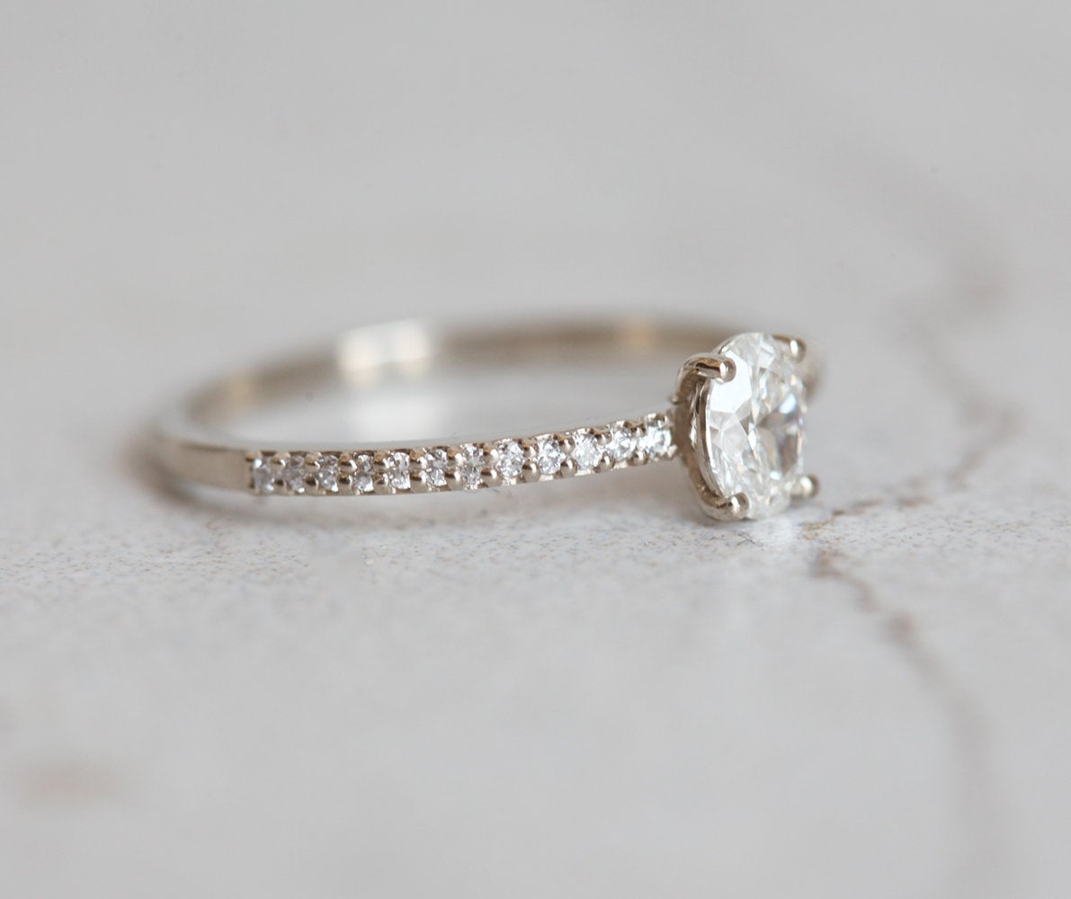 Oval White Diamond with half eternity pave diamond ring