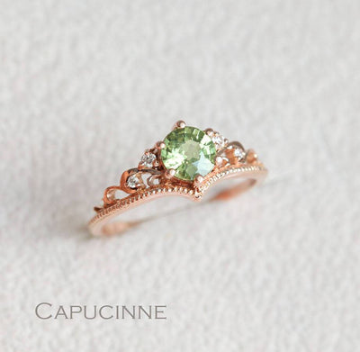 Round green sapphire ring with white side diamonds