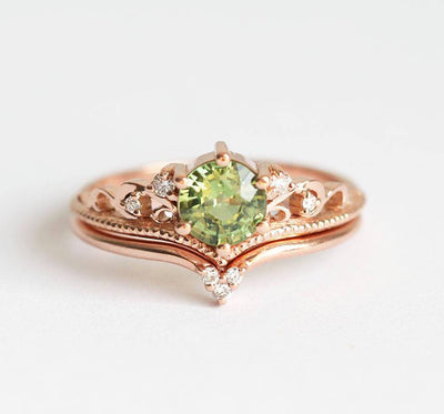 Round green sapphire ring with white side diamonds